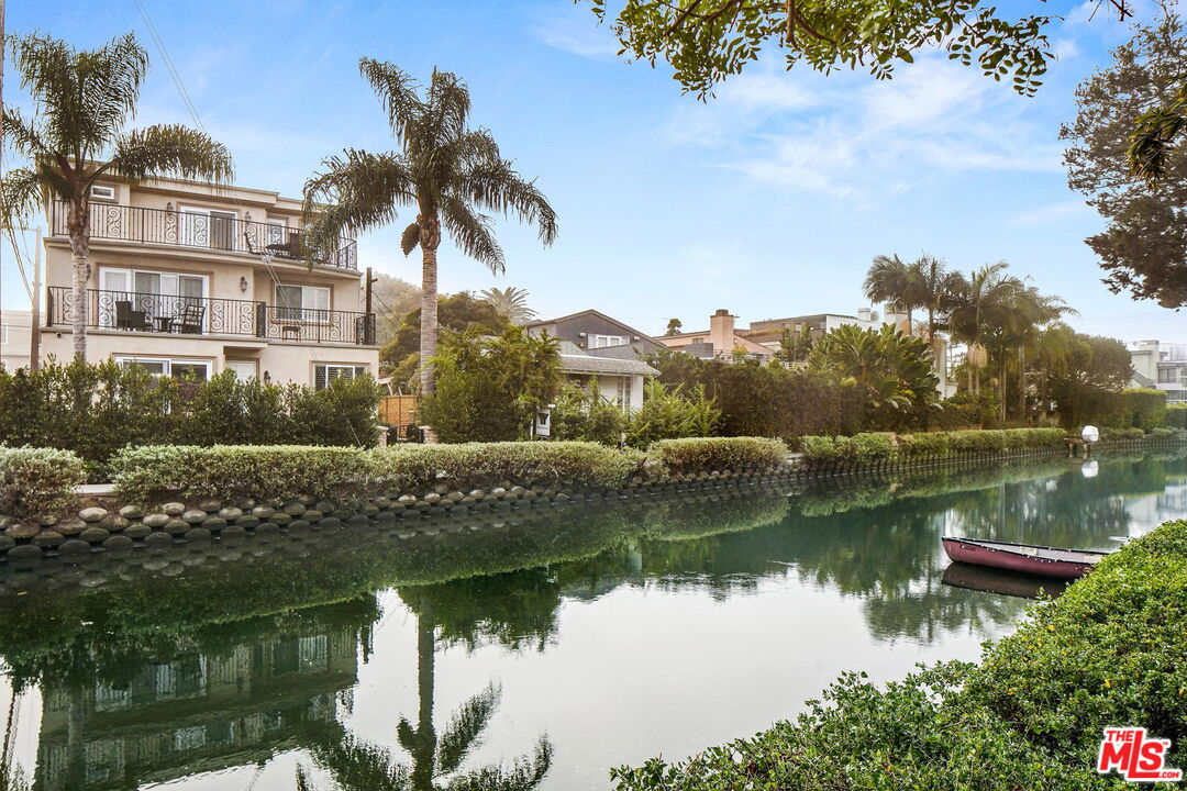 a view of a lake with a house in the background