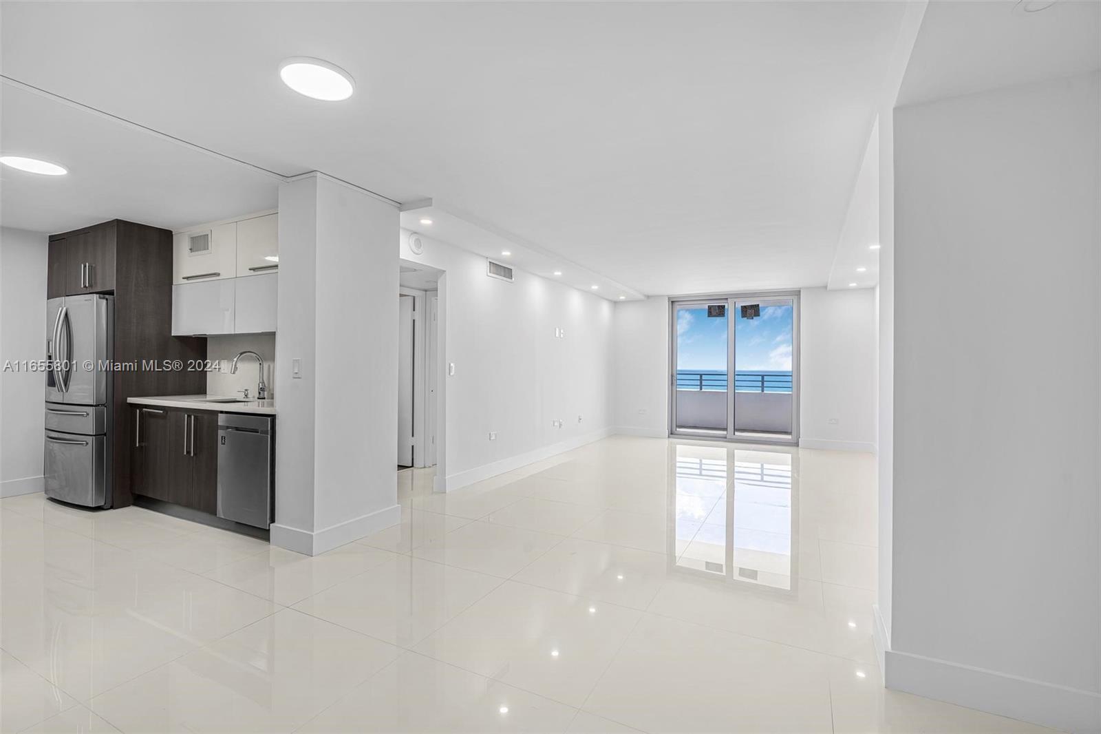 a kitchen with stainless steel appliances a refrigerator and a sink