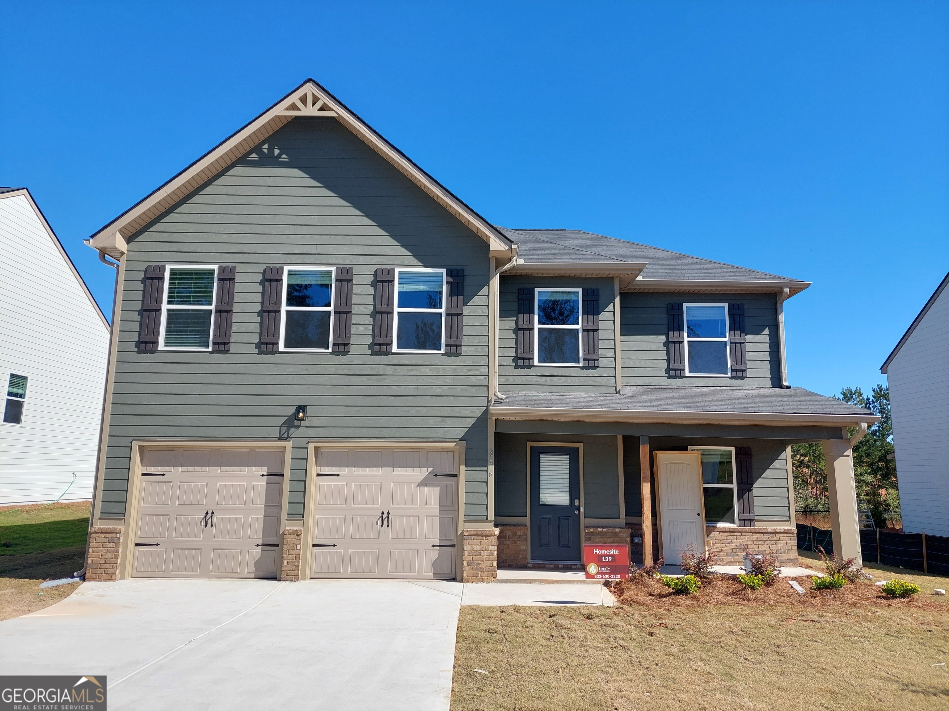 a front view of a house with yard