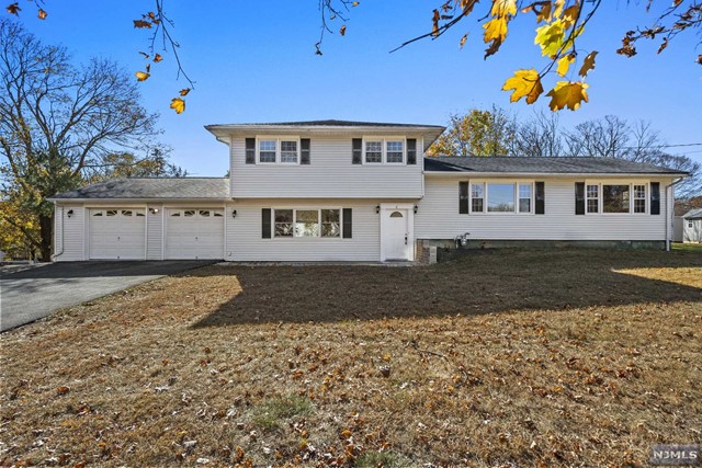 a house view with a backyard space