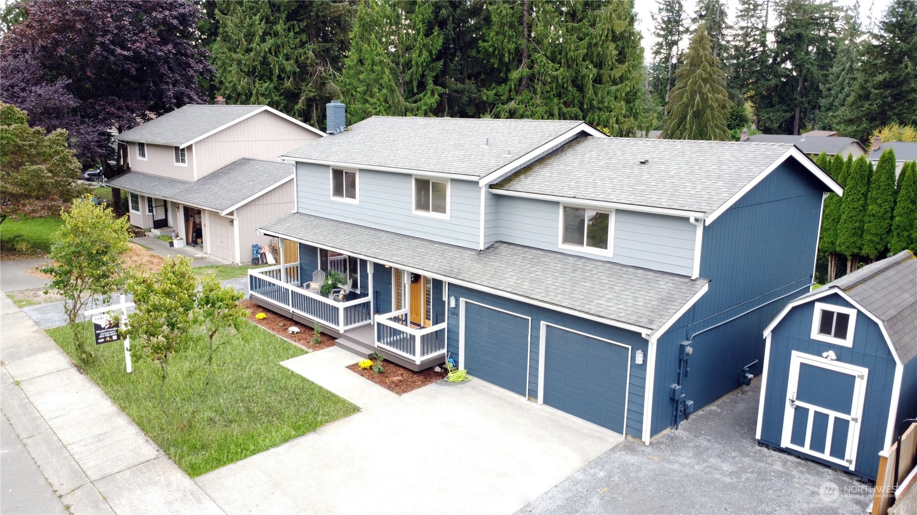 a aerial view of a house with a yard