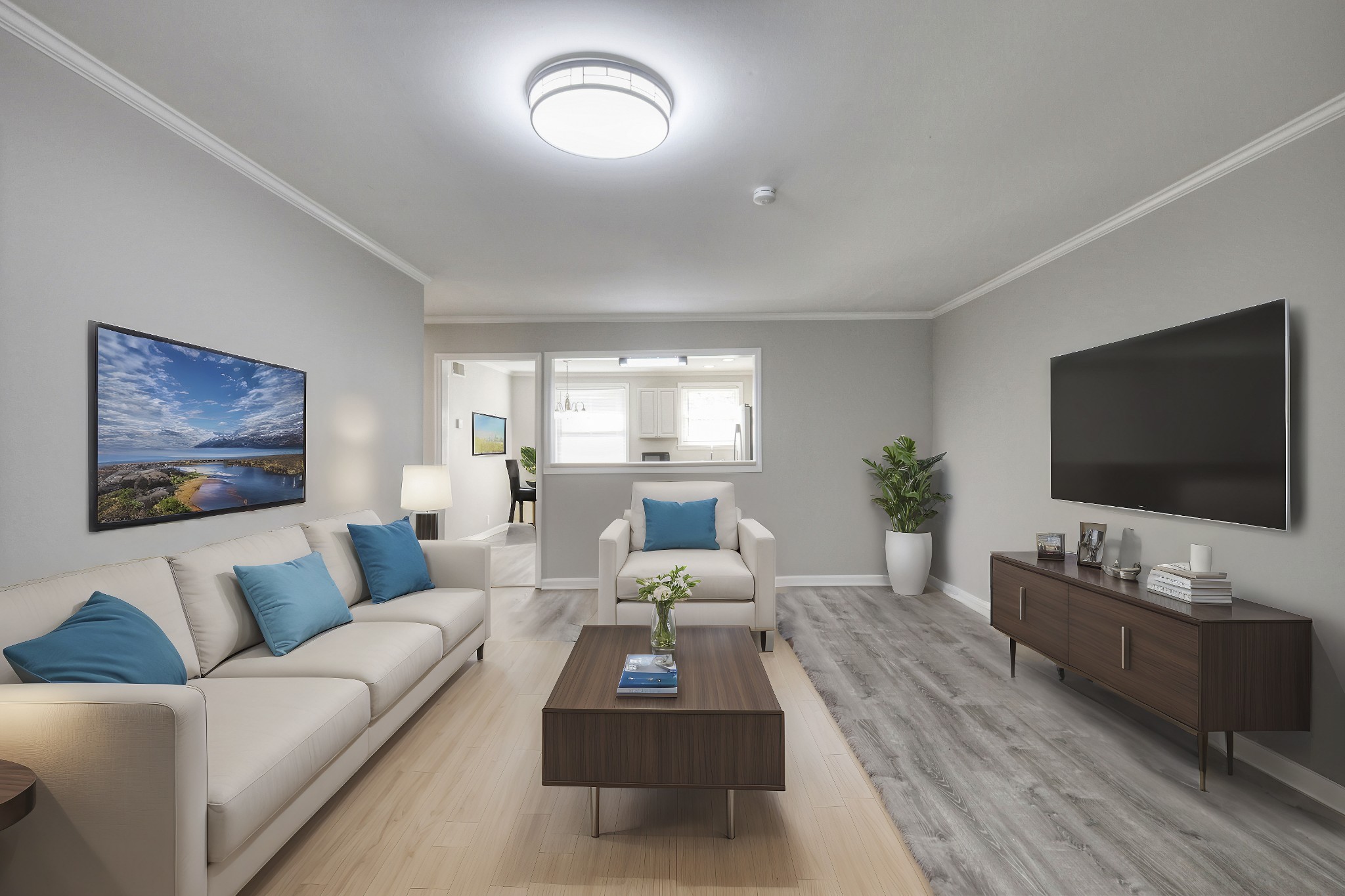 a living room with furniture flat screen tv and wooden floor