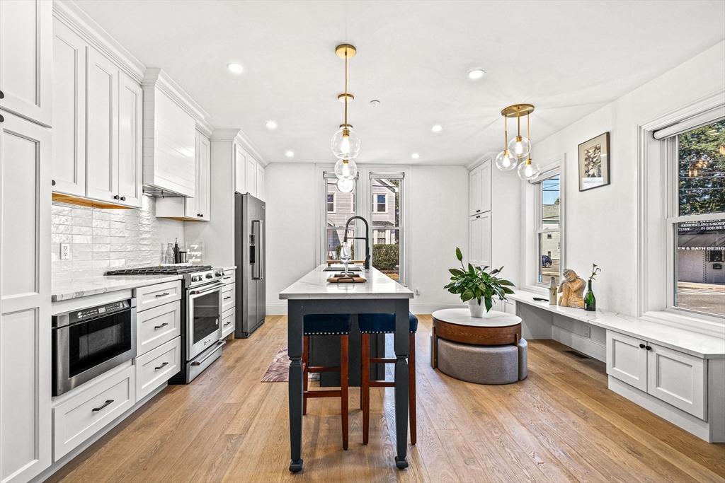 a kitchen with a table and chairs