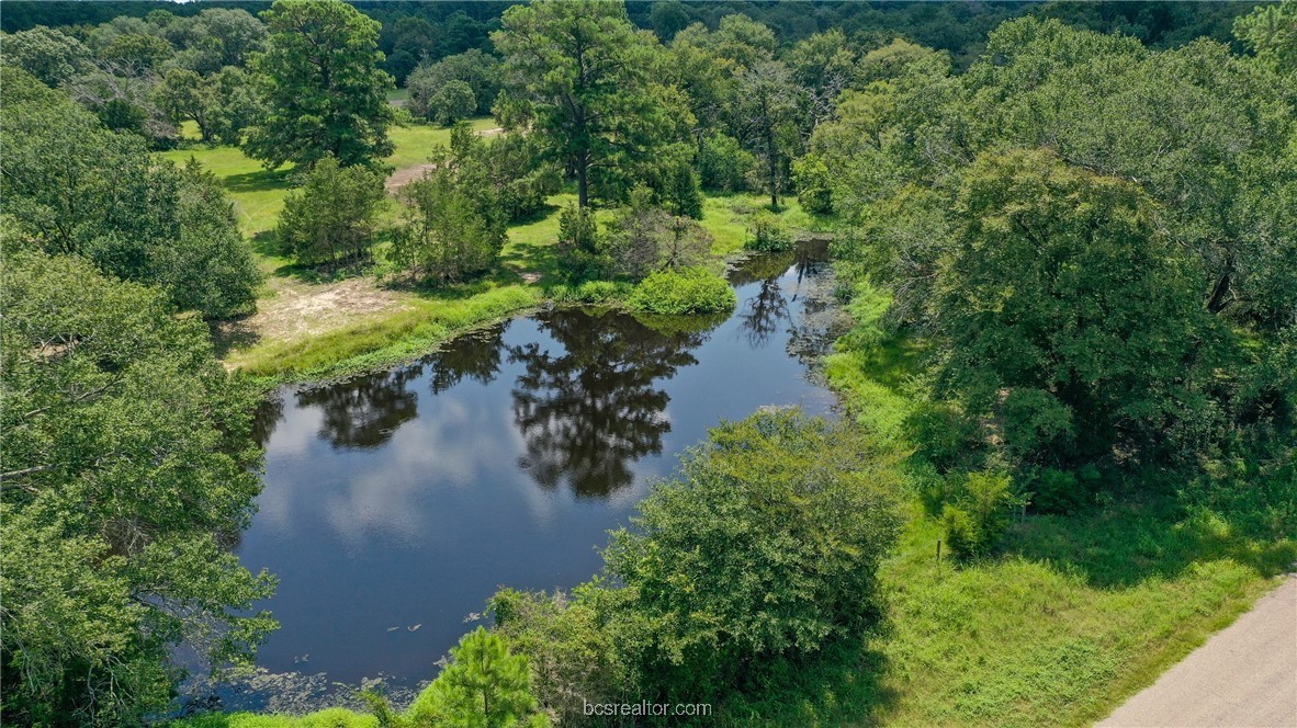 a view of a lake with green space