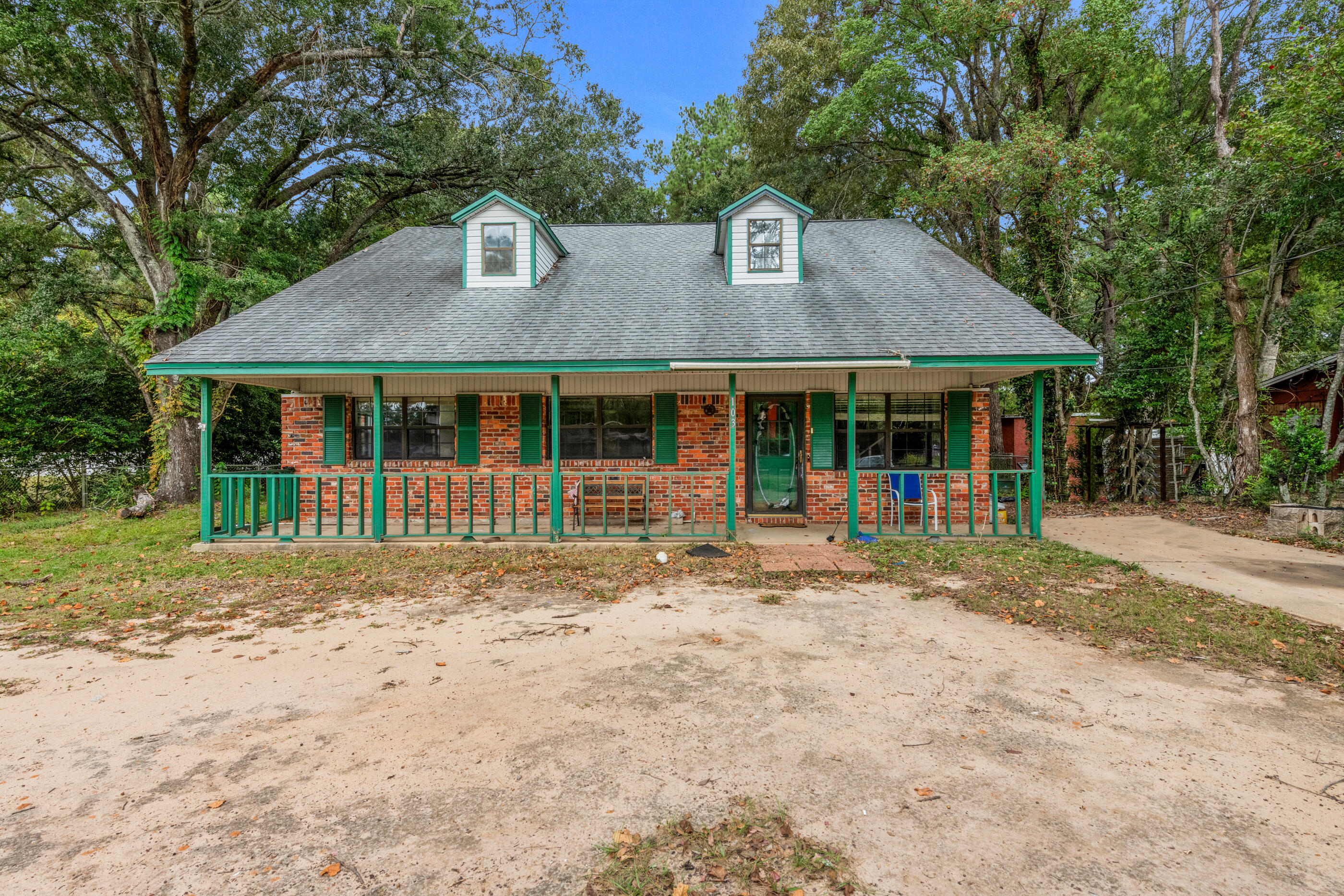 a front view of a house with a porch