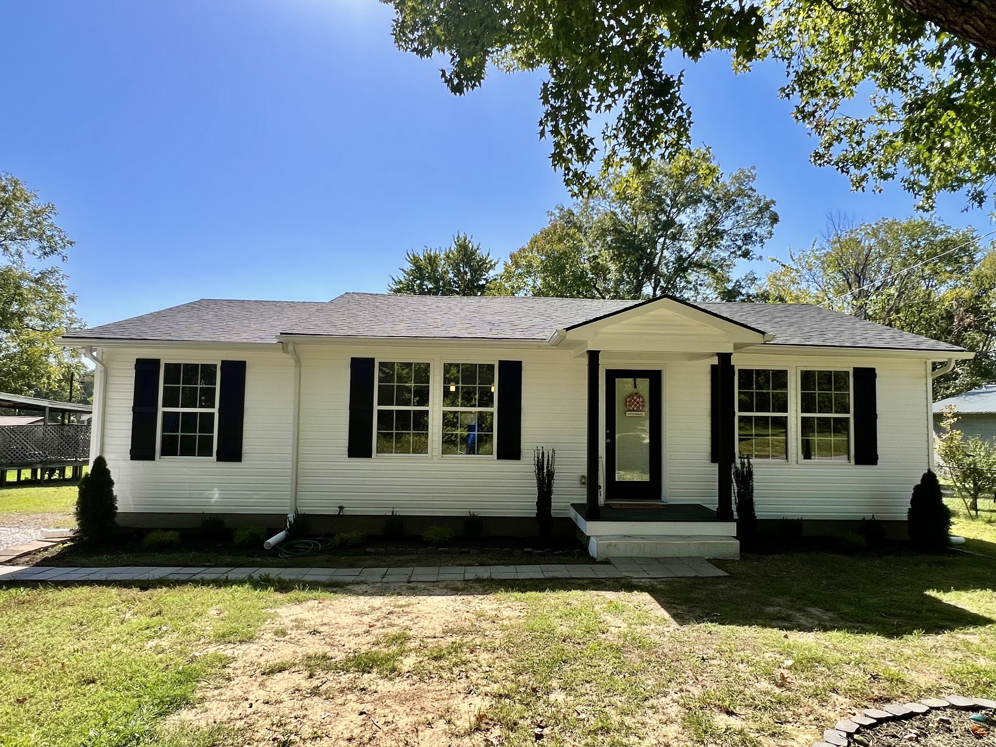 a front view of a house with a yard