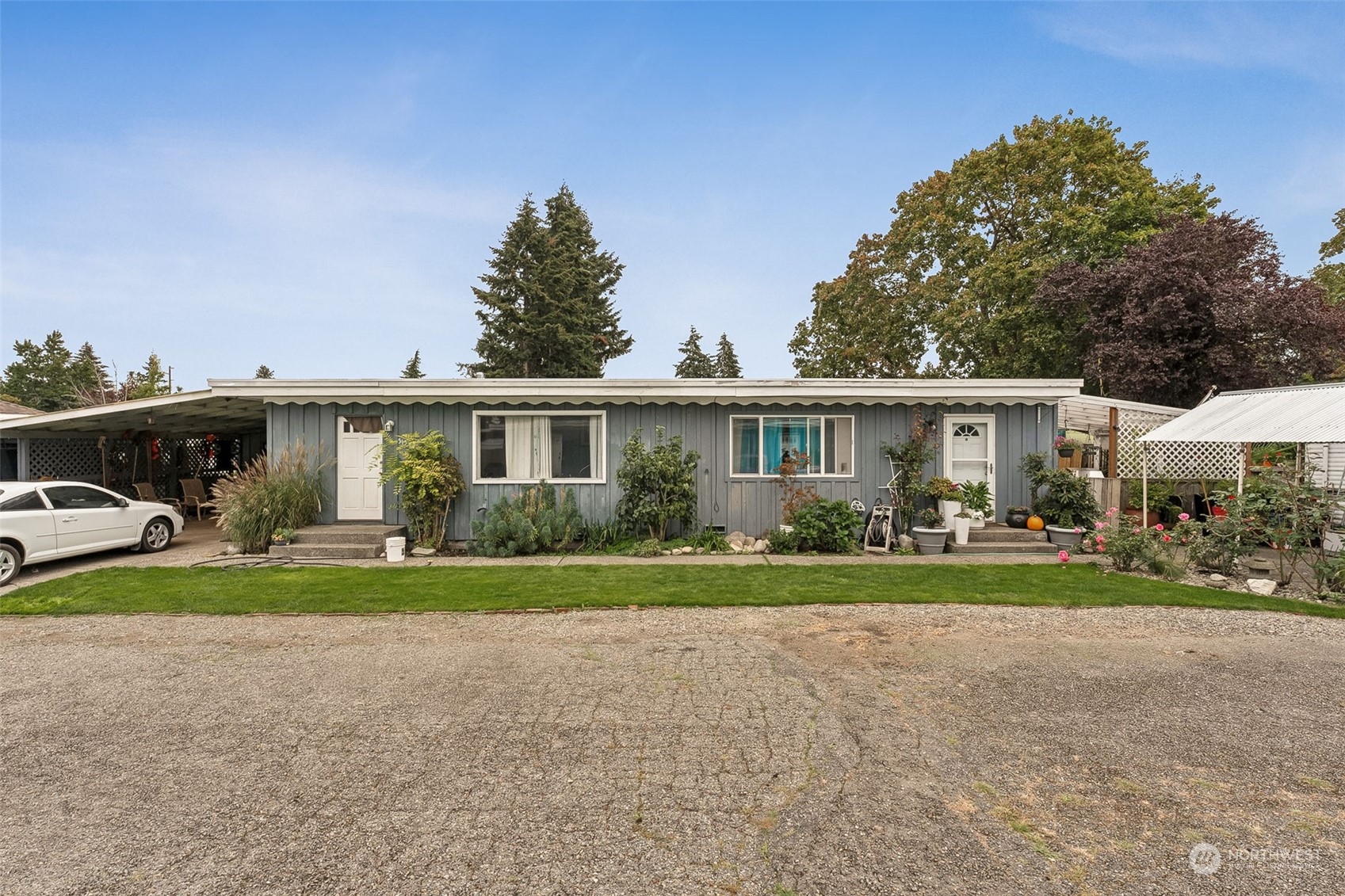 a front view of a house with a yard and porch