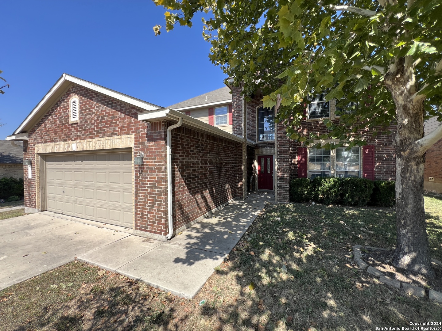 a front view of a house with a garage