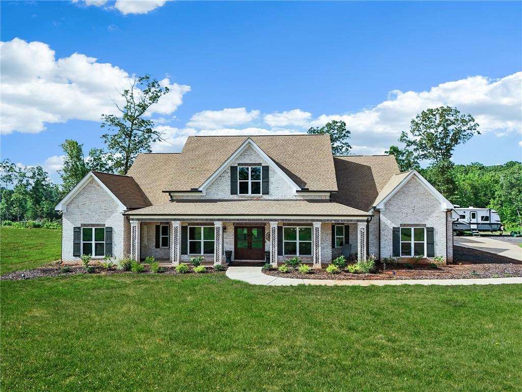 a front view of a house with a yard