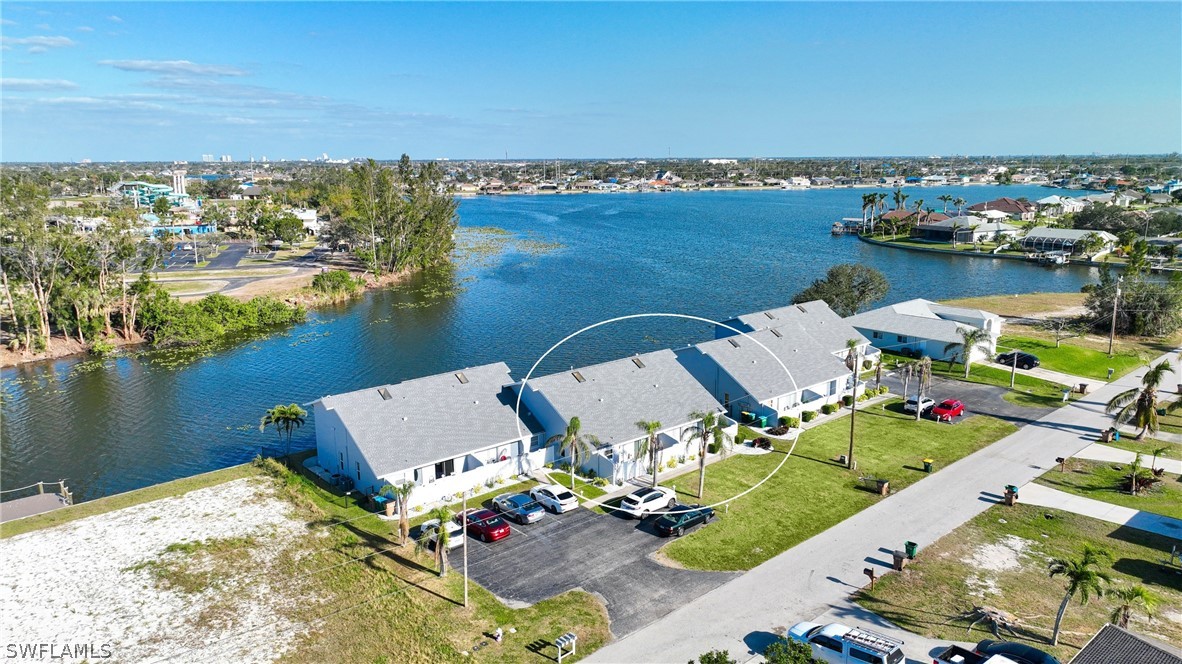 an aerial view of a house with a ocean view