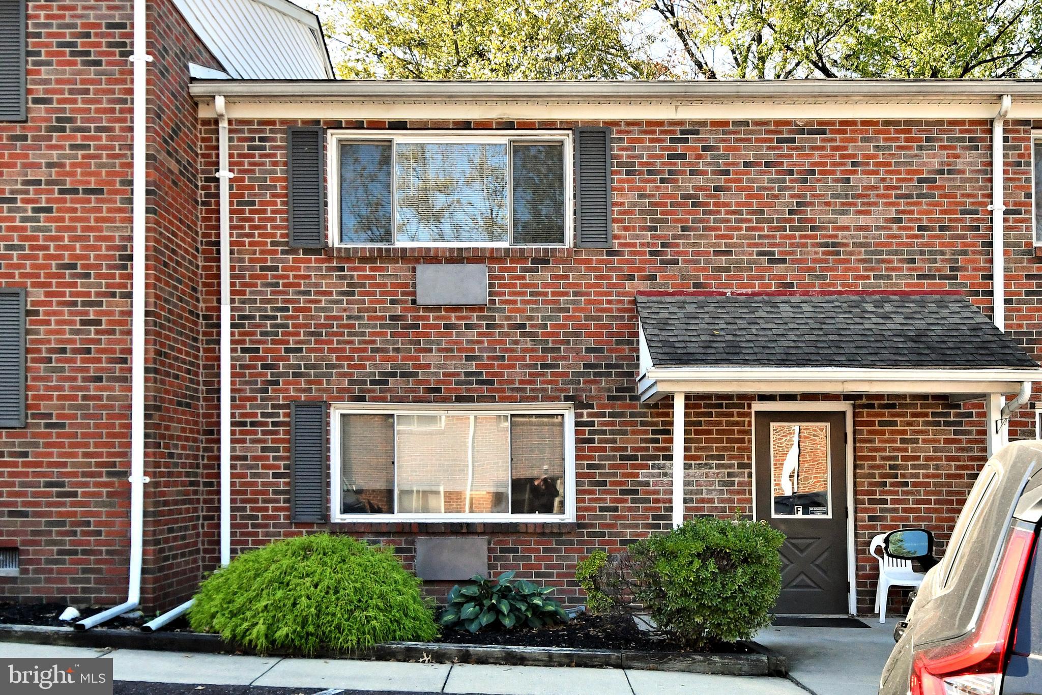 a view of a brick house with a large windows