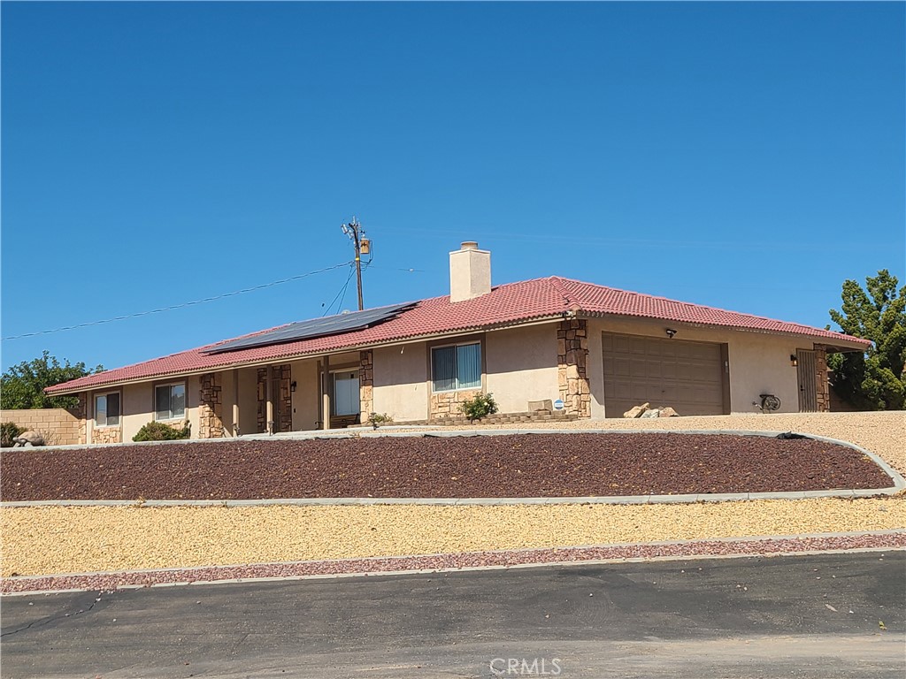 a front view of a house with a garage