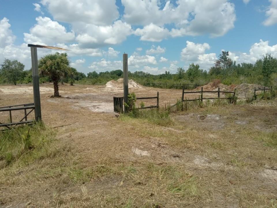 a view of a lake with a yard