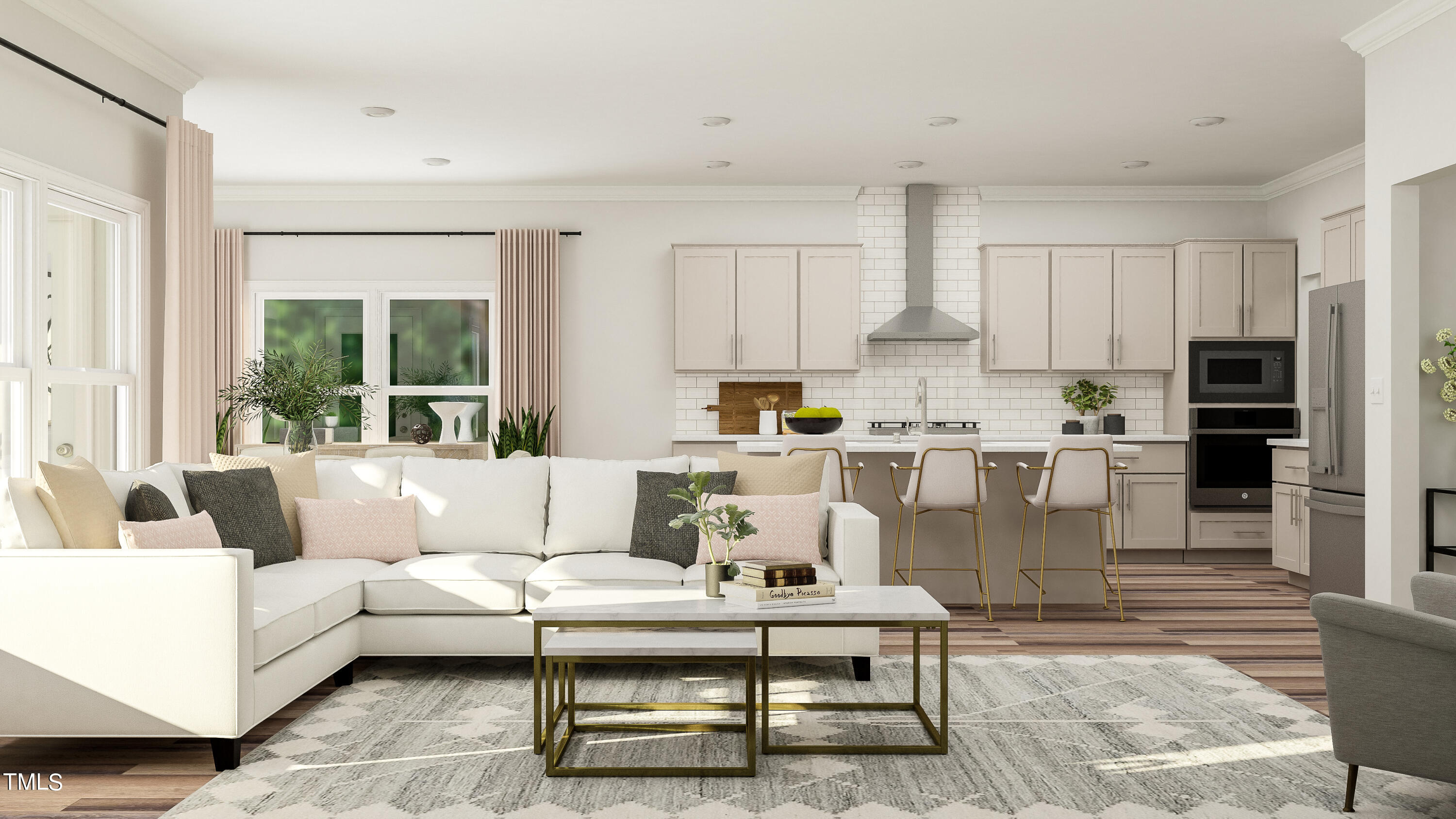 a living room with stainless steel appliances furniture and a kitchen view