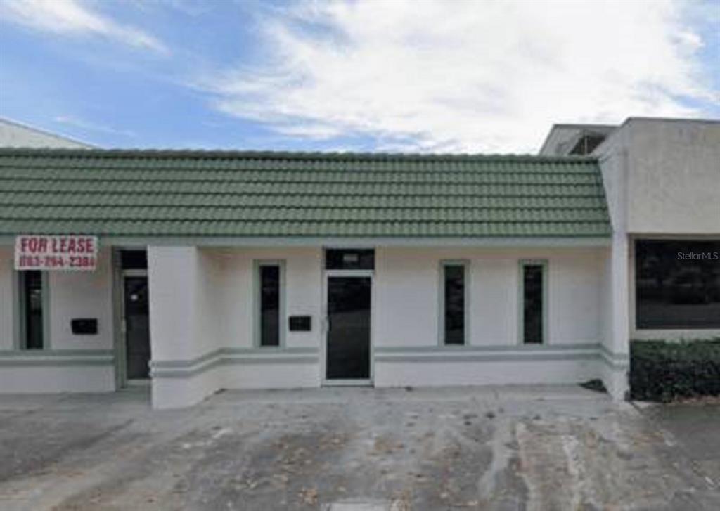 a front view of a house with a garage