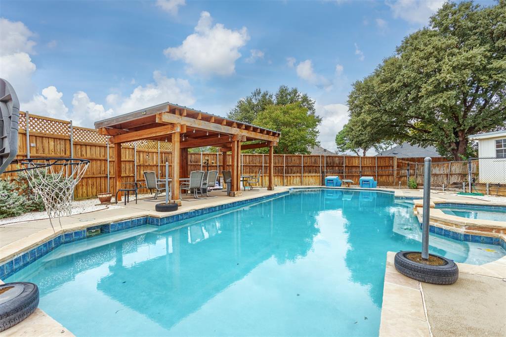 a view of a swimming pool with a lounge chairs