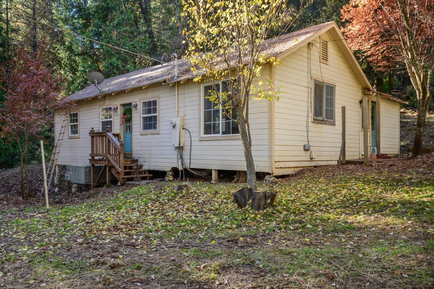 a view of a house with a yard and chair