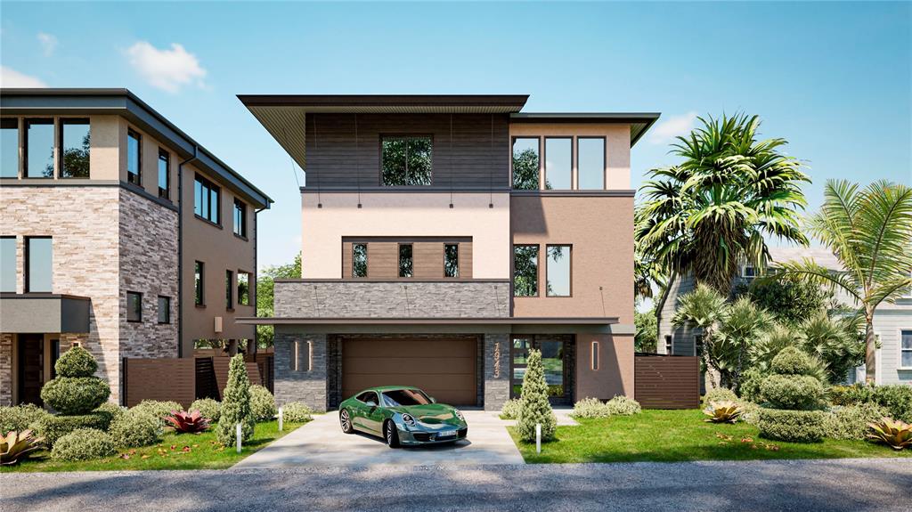 a front view of a house with yard and outdoor seating