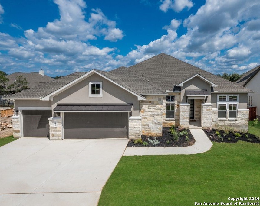 a front view of a house with a yard