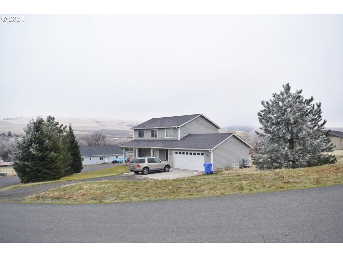 a view of house with outdoor space