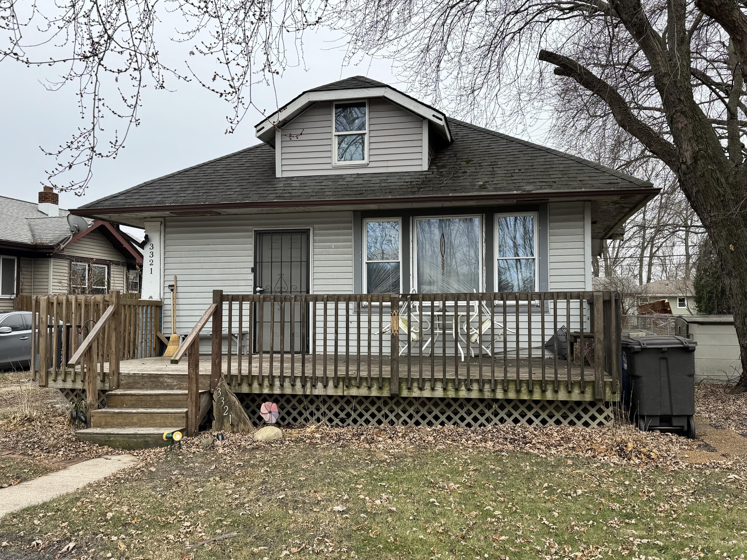 a front view of a house with a fence