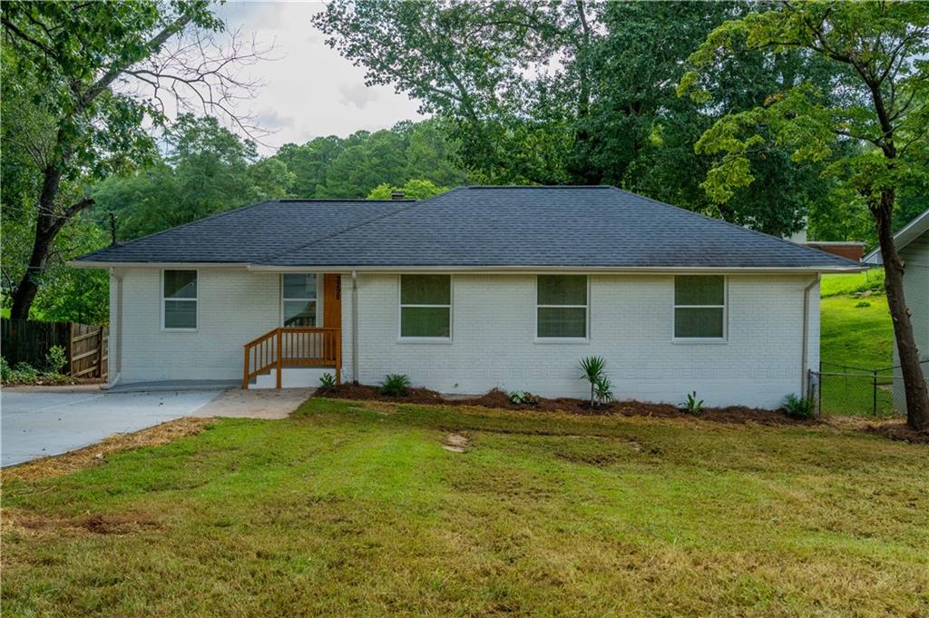 a house with trees in the background