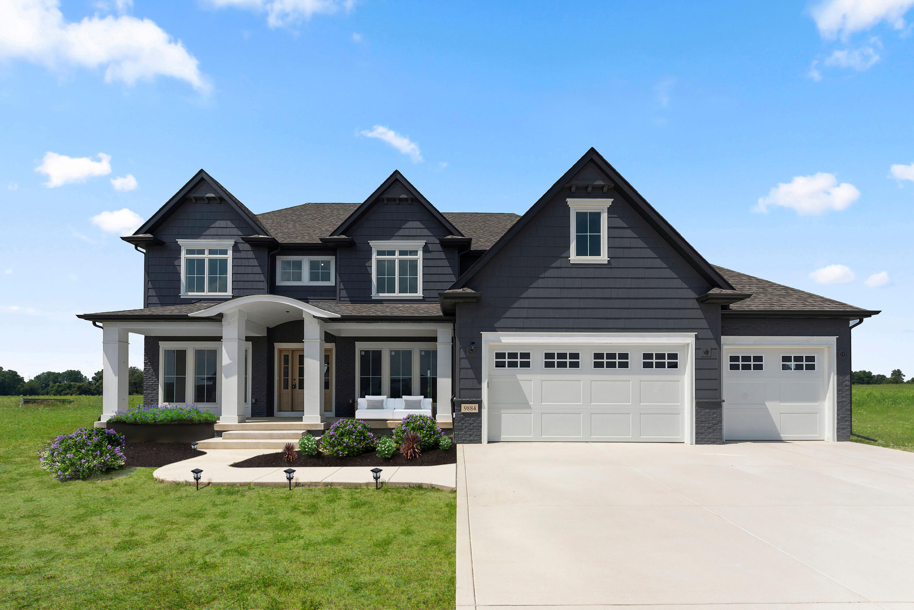 a front view of a house with a yard