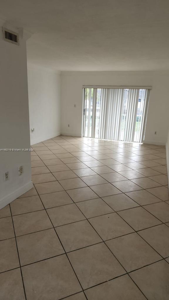 a view of empty room with windows