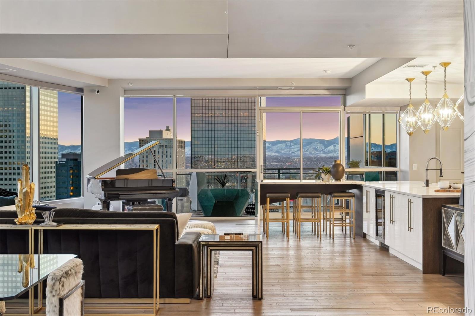 a kitchen with stainless steel appliances granite countertop a stove and a dining table with garden view