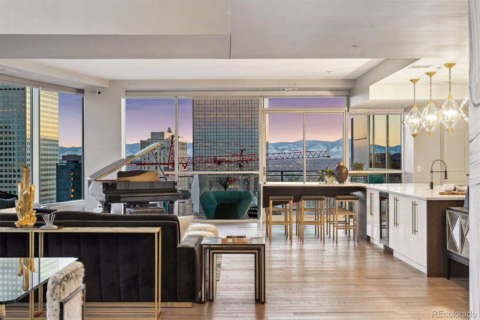 a kitchen with stainless steel appliances granite countertop a stove and a dining table