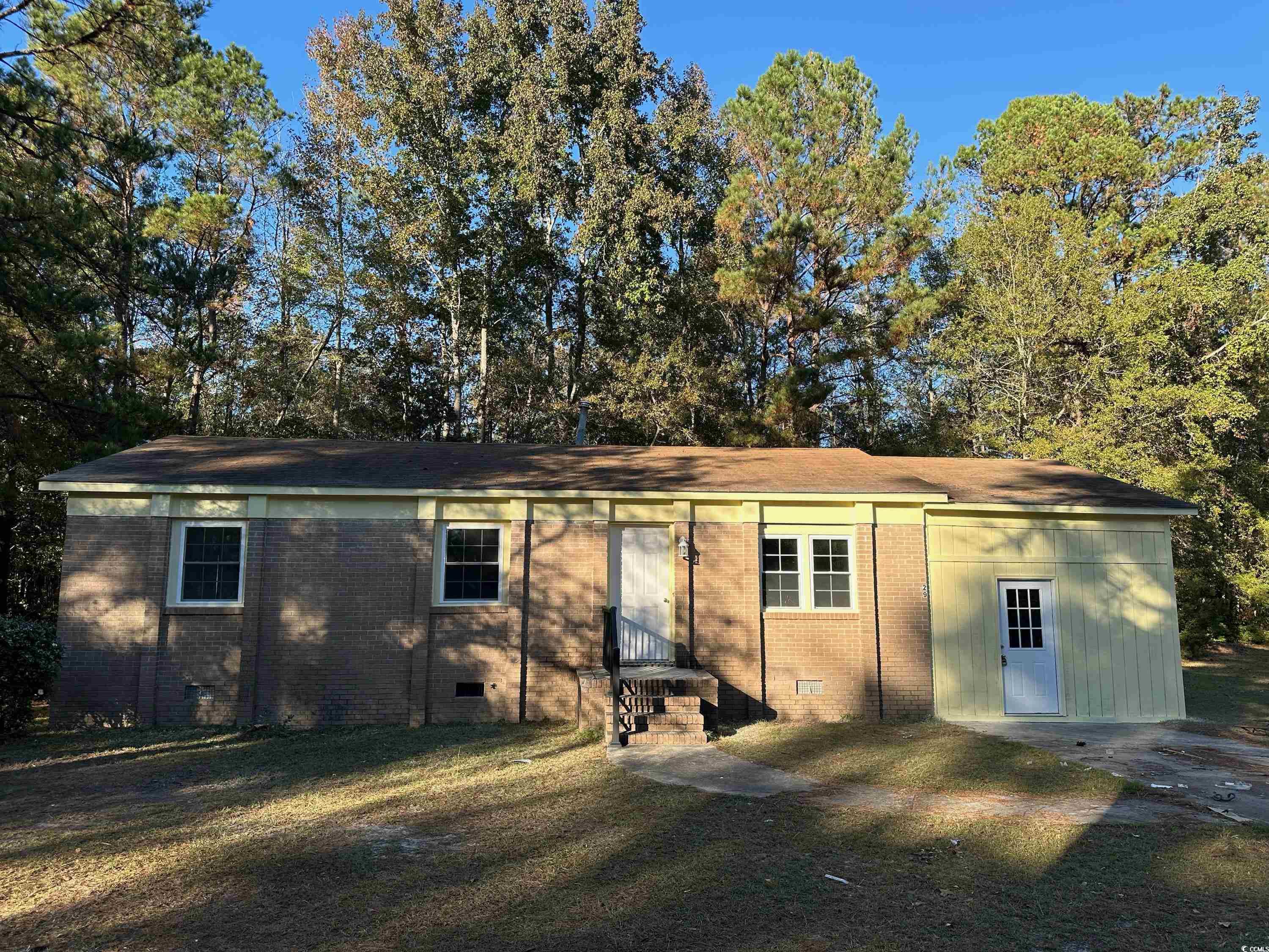 View of front of property featuring a front yard