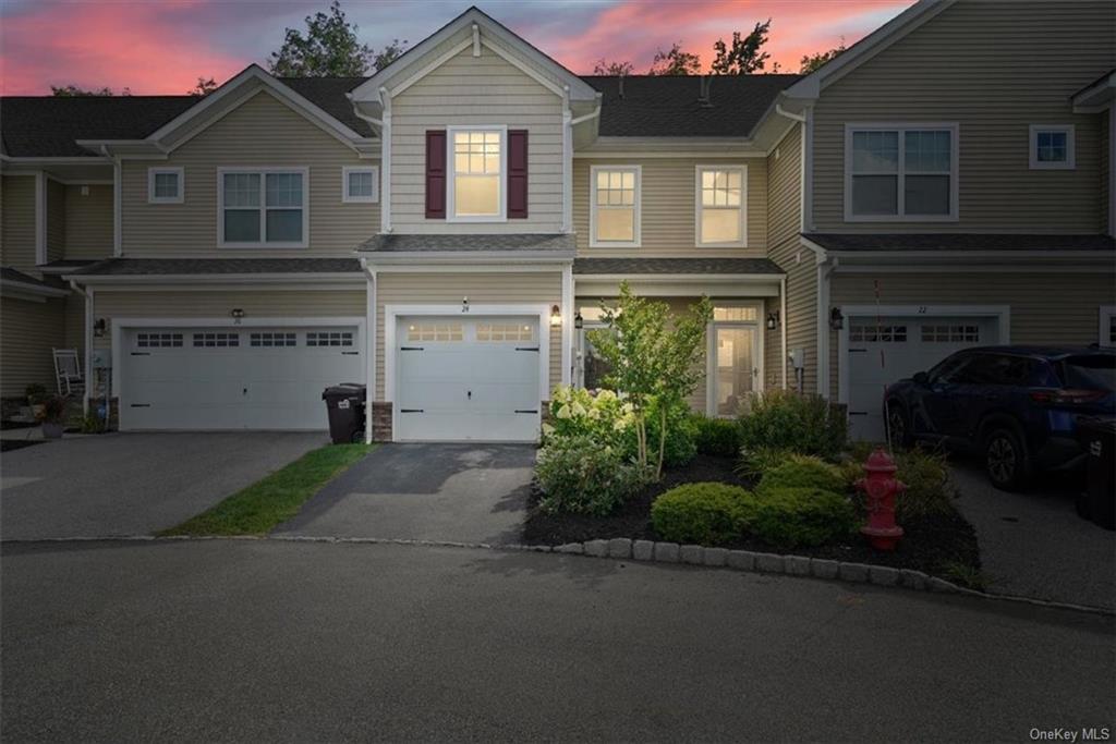 View of front of property with a garage