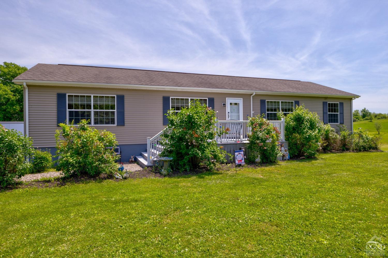 front view of a house with a yard