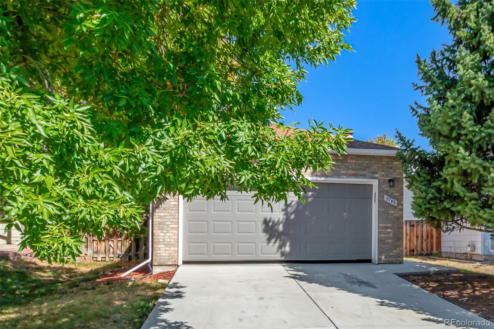 a house with a tree in front of it