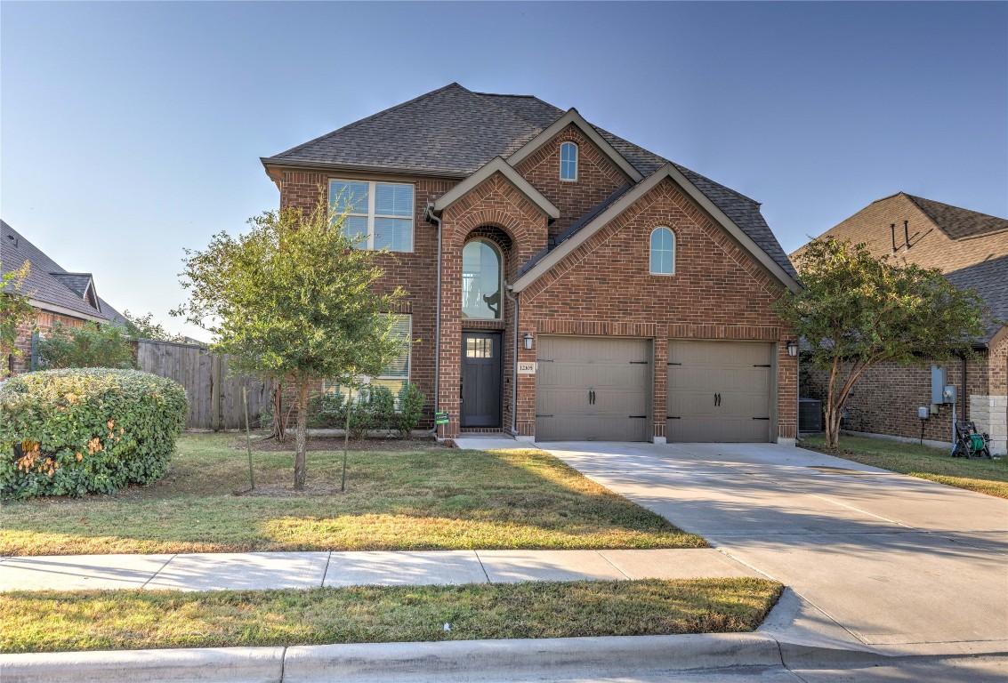 a front view of a house with a yard