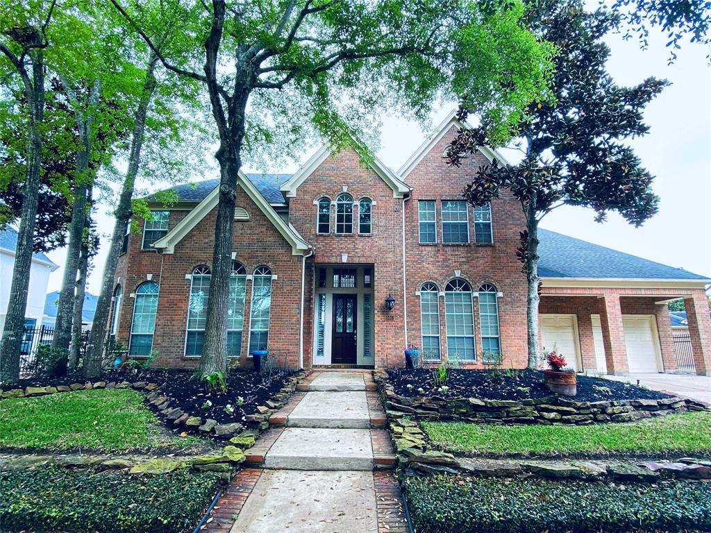 front view of a house with a garden