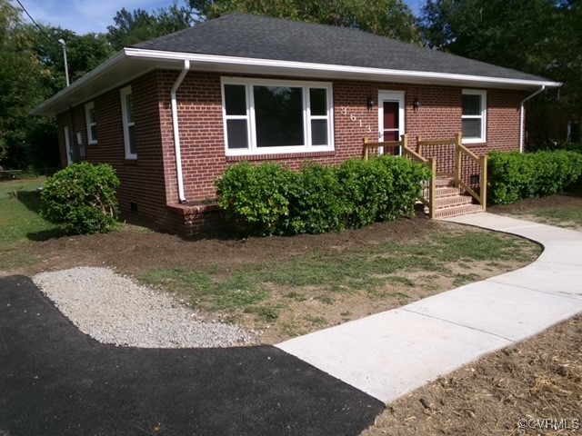 front view of a house with a yard