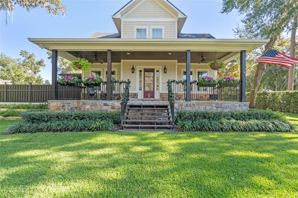 a view of a house with garden and plants