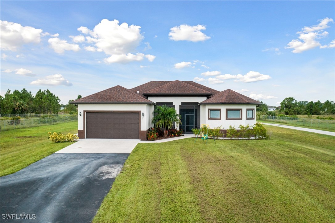 a front view of a house with a yard