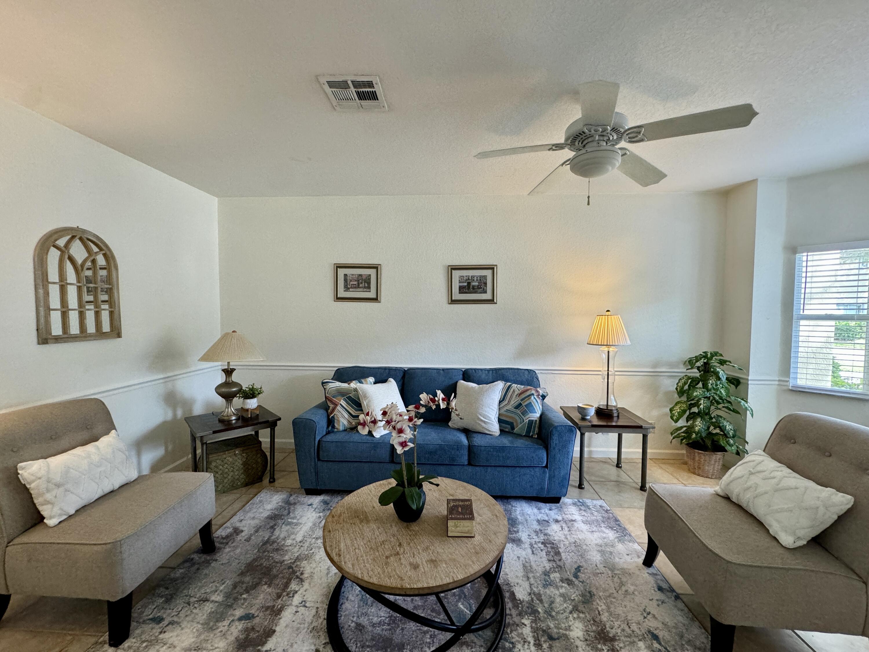 a living room with furniture and a table