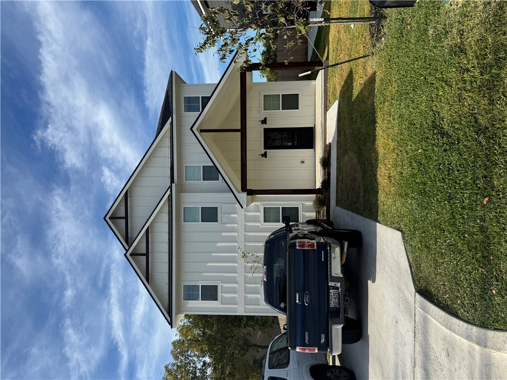 a house view with a garden space