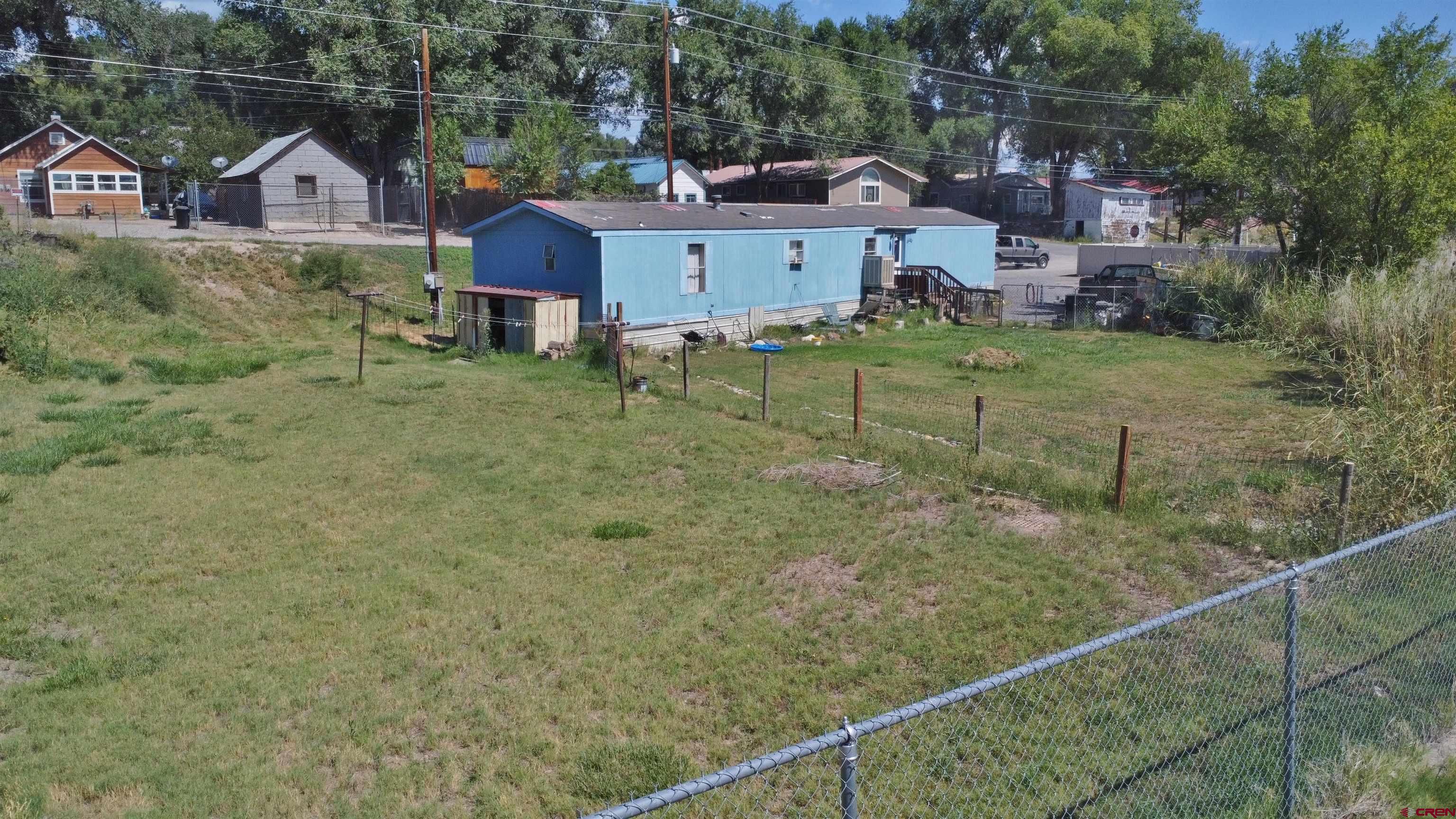 Back of the 1994 doublewide manufactured home currently leased at $1,200 per month.