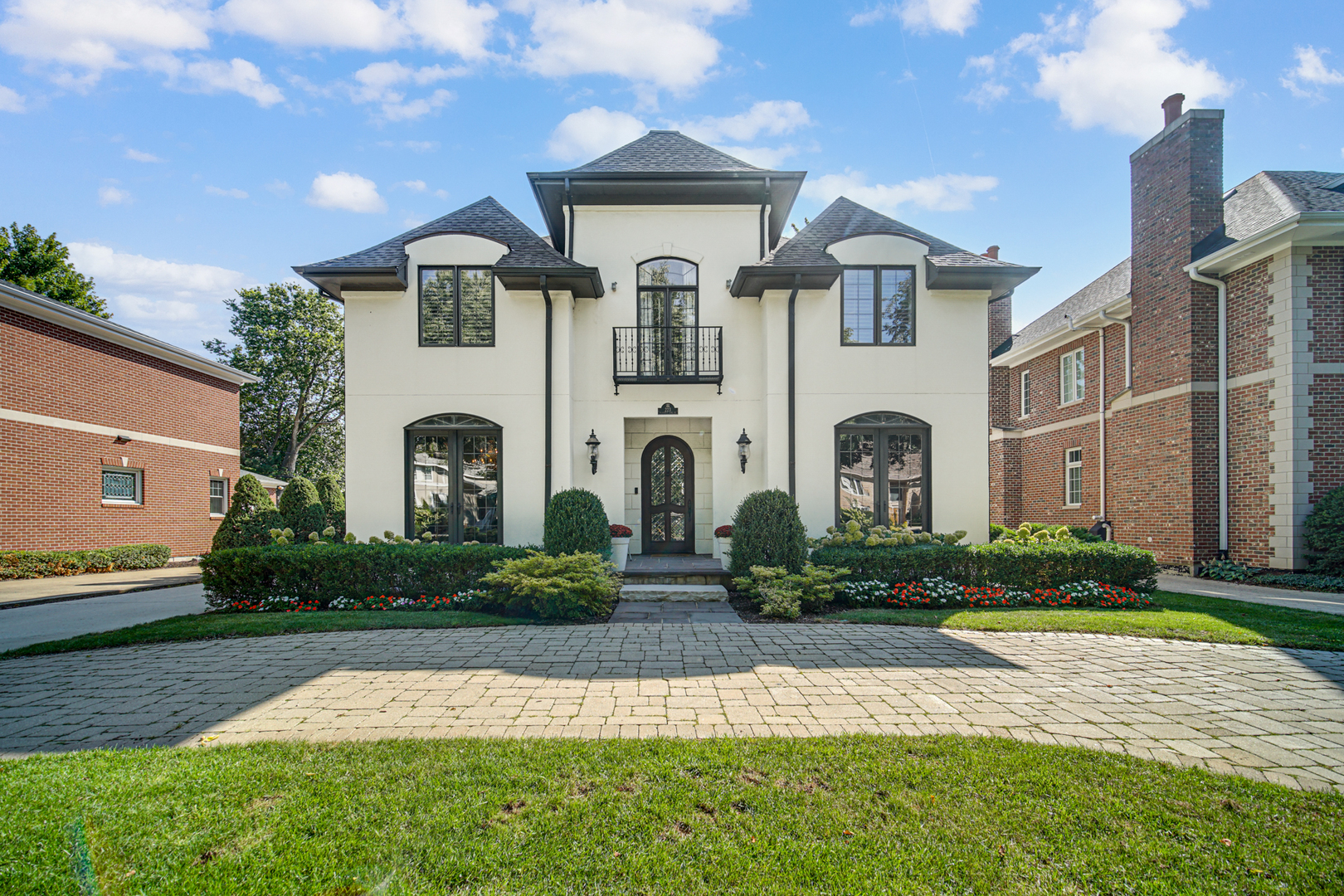 a front view of a house with garden