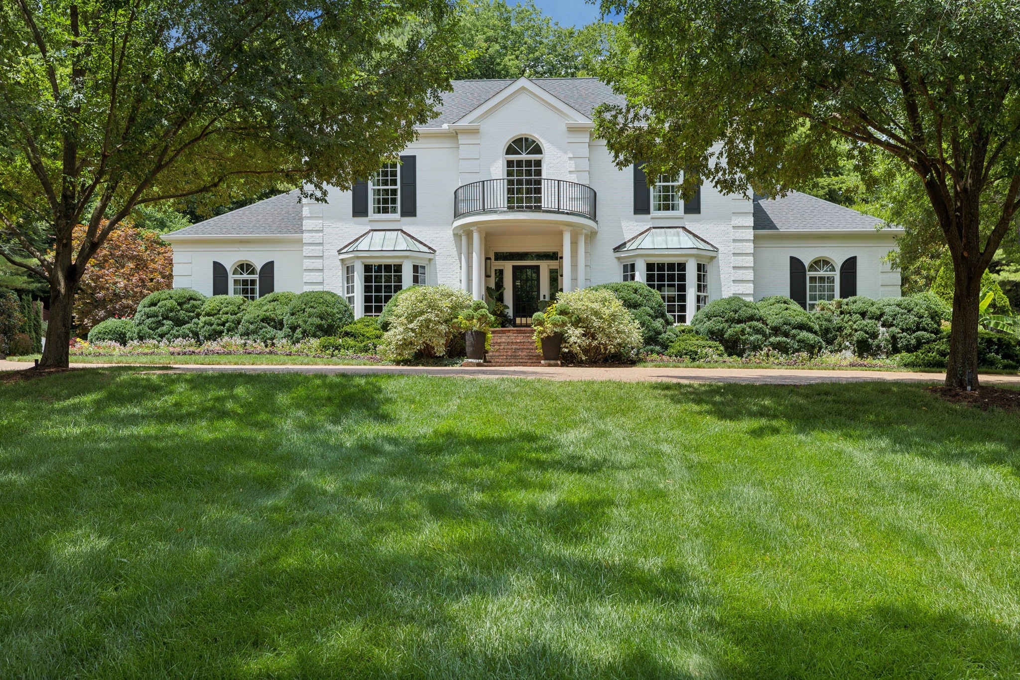 a view of house with yard and green space