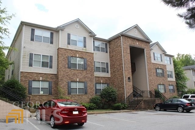 a front view of a house with parking