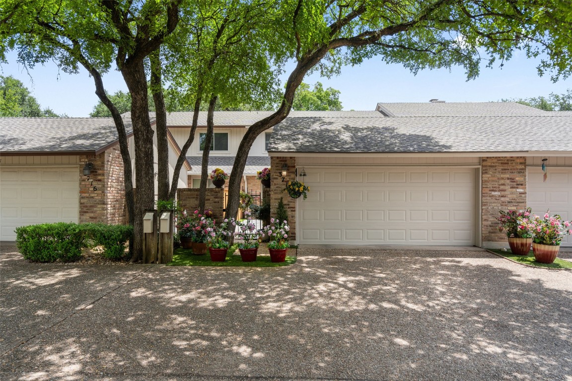 a view of a house with a tree and chair