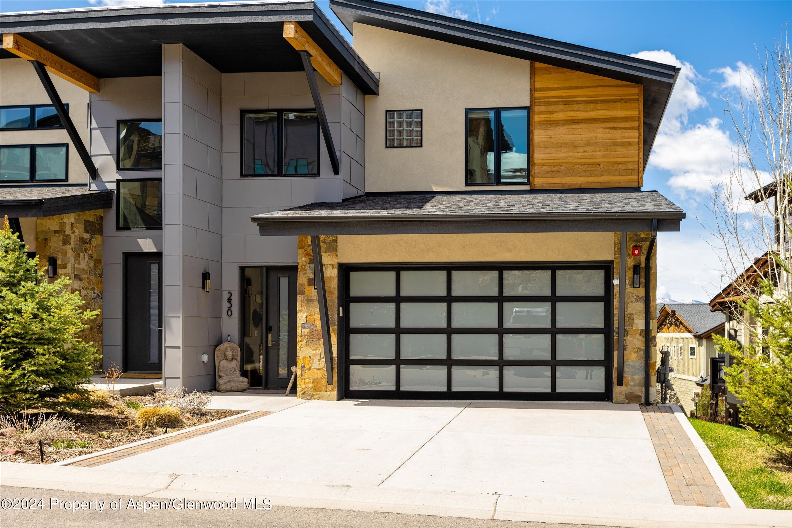 a front view of a house with garage