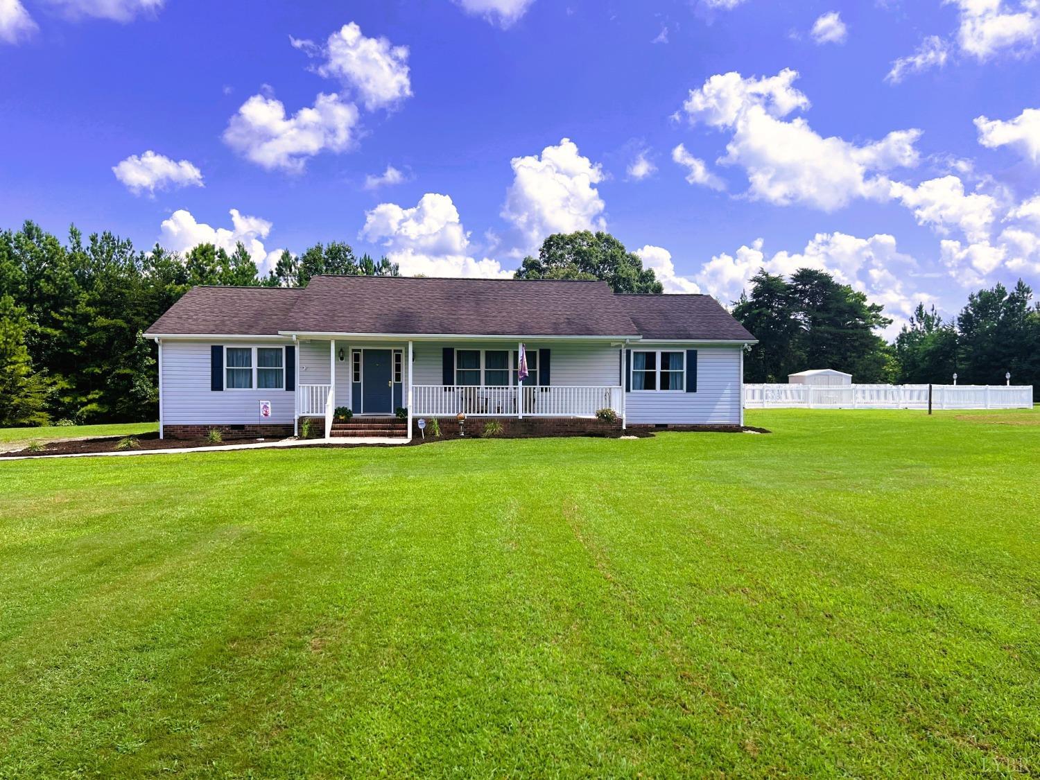 a view of a house with a big yard