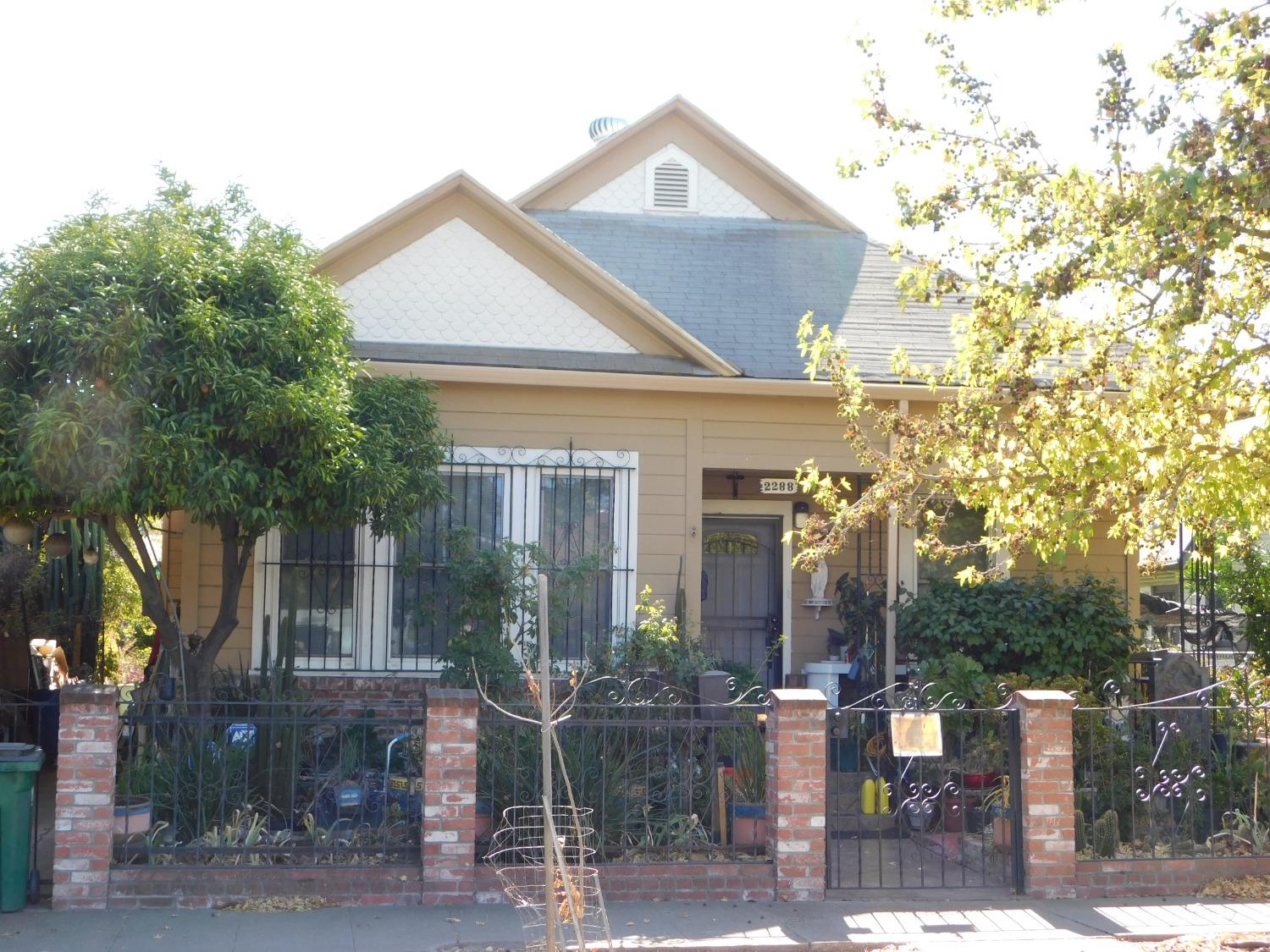 a front view of a house with garden