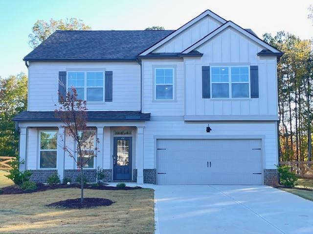 a front view of a house with garage